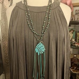 Multi strand necklace with rustic metal Indian pendant